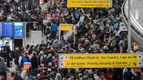 People wait in a TSA line at the John F. Kennedy International Airport, Sunday, March 22, 2026, in New York. (AP Photo/Yuki Iwamura)
