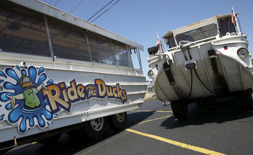 Duck boats sit idle in the parking lot of Ride the Ducks days after the accident in July in Branson, Mo. Kenneth Scott McKee, the captain and operator of a boat that sank on July 19, was charged on Thursday with criminal misconduct and negligence resulting in 17 deaths on Table Rock Lake.