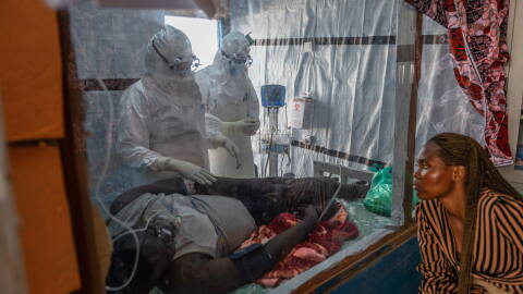 Health workers tend to an Ebola patient at the Rwampara Treatment Center in Ituri, Congo, Thursday, June 18, 2026.
