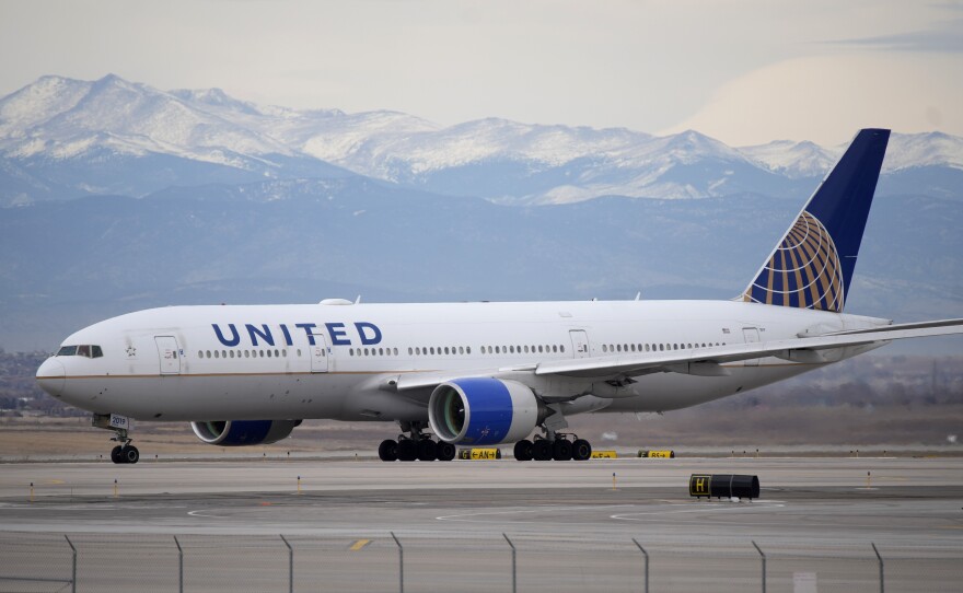 A United Airlines jetliner taxis to a runway for take off from Denver International Airport, Dec. 27, 2022.