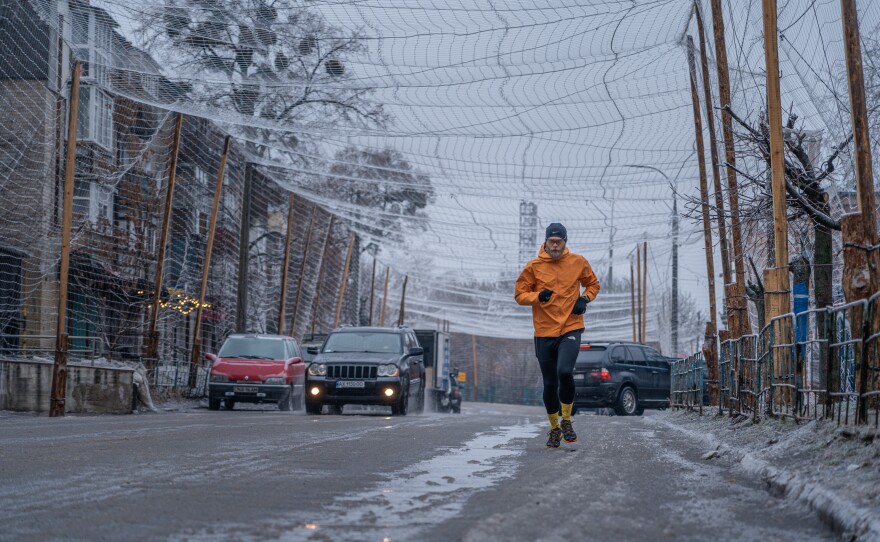 Drone nets cover the streets of Izium, Ukraine, on Feb. 7. The netting discourages drones from diving at cars and people because their propellers get tangled in it.