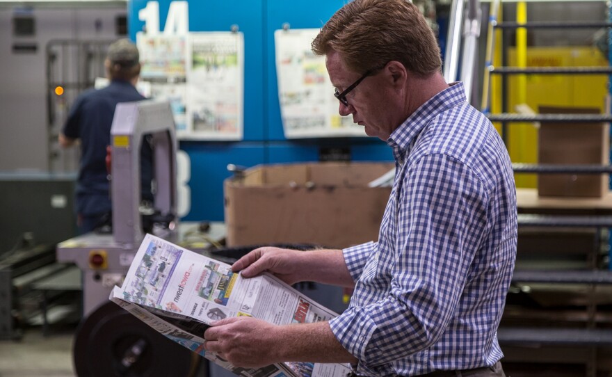 President of Iowa Information Publications and White Wolf Web Printers Jeff Wagner looks through a freshly printed newspaper at his large printing press in Sheldon, Iowa. Wagner's press prints about 80 newspapers a week. Wagner's company runs N'West Iowa News, The Sheldon Mail Sun and The Sioux Center News.