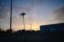 The sun sets over an intersection in San Diego's Barrio Logan neighborhood on Aug. 15, 2023.