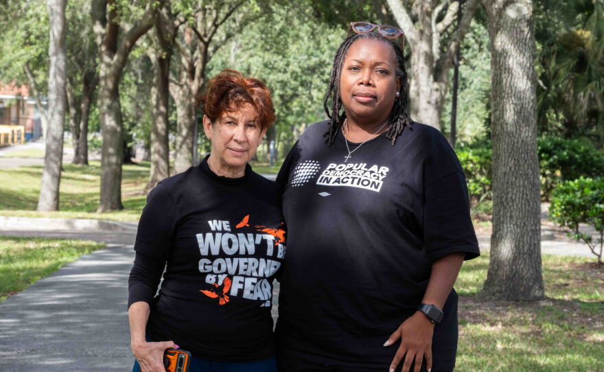 Florida Rising volunteers Maggie Fernandez (left) and Tia Bell-Williams pose for a portrait after a day of canvassing in neighborhoods around Jacksonville. Fernandez, a homeowner, is encouraging voters to say 'no' on Amendment 3.