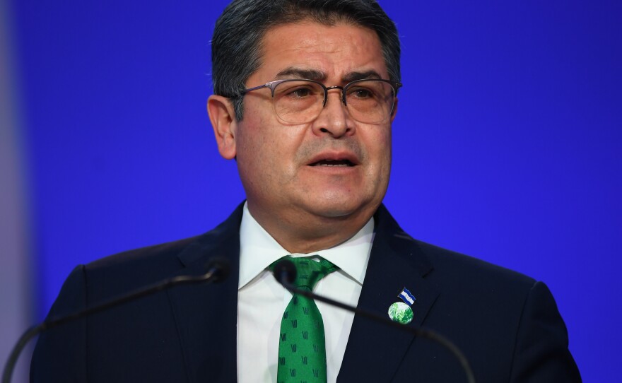 On Nov. 1, 2021, Honduran President Juan Orlando Hernández delivers his national statement during day two of the U.N. Climate Change Conference in Glasgow, Scotland.