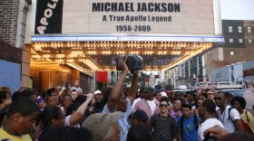 The Apollo Theater's marquee memorializes pop star Michael Jackson as crowds of fans gather outside to remember him on June 25, 2009 in New York City. Jackson, 50, the iconic pop star, died after going into cardiac arrest in a hospital today in Los Angeles, California. 