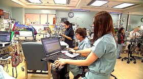 Nurses and doctors at work in a hospital's intensive care unit. 
