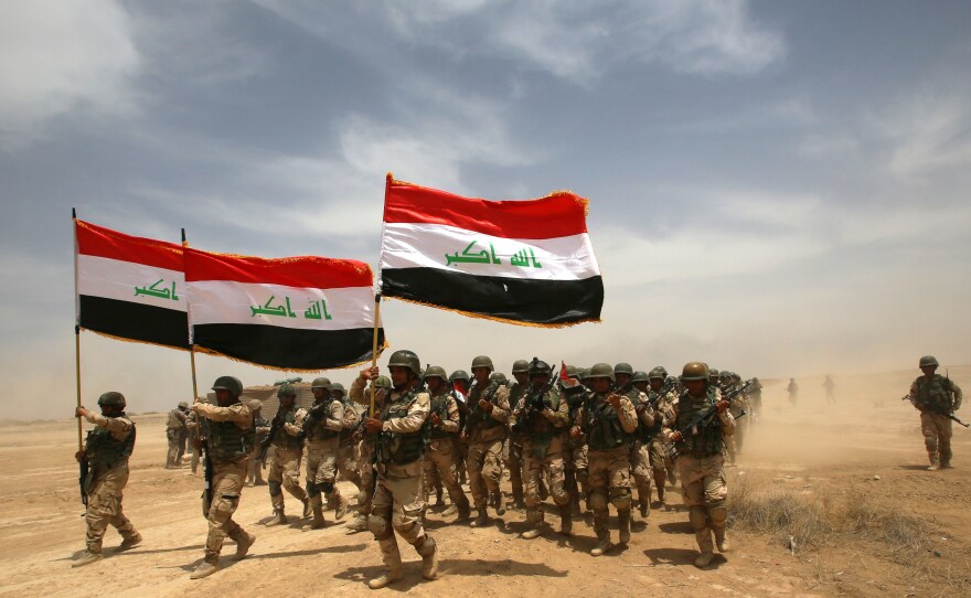 Thousands of Iraqi soldiers in Baghdad take part in a training exercise in 2015. On Saturday, the Iraqi prime minister announced its war on the Islamic State group was over, after more than three years of fighting.