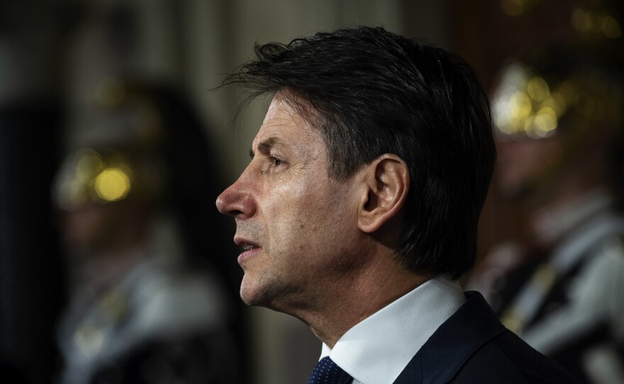 Law professor Giuseppe Conte, Italy's new prime minister designate, speaks to the media to present his ministers list after being appointed by Italian President Sergio Mattarella on Thursday in Rome, Italy.