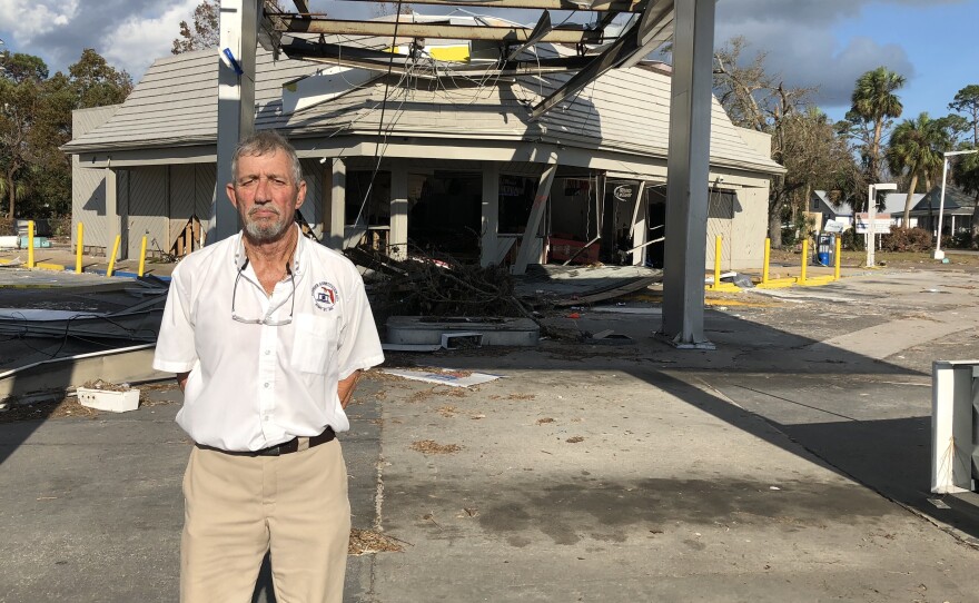 Port. St. Joe Mayor Bo Patterson stands in front of what's left of one of the towns two gas stations. Both were destroyed by Hurricane Michael, the fuel pumps torn from their concrete slabs.