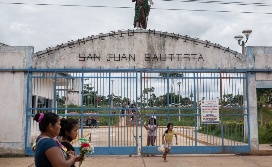 People visit the San Juan Bautista cemetery in Iquitos, Peru.