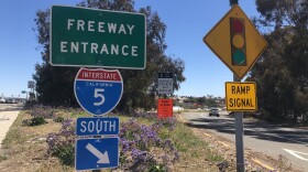 A car drives onto the onramp for the I-5 south at the Palomar Airport Road exit, March 23, 2022.
