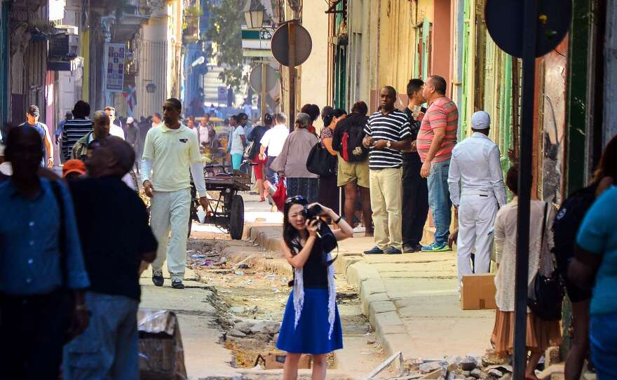 A tourist takes pictures in Havana last week..