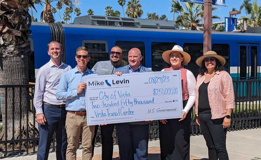 Rep. Mike Levin (second from left) presenting a $250,000 check to Vista Councilmembers Dan O'Donnell (left), Mayor John Franklin (center), Councilmember Katie Melendez and Deputy Mayor Corinna Contreras (right) to study grade separation at the Vista Transit Center, Aug. 29, 2023.