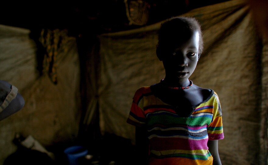 One of the camp's 124,000 residents in her shelter.