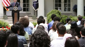 Former President George W. Bush speaks to student from the Youth Exchange and Study program at the White House in 2005. The program began in 2004 and ended for Afghan students this year after half of those enrolled fled to Canada.