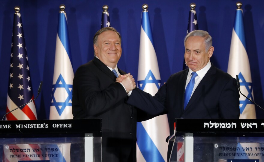 U.S. Secretary of State Mike Pompeo, left, shakes hands with Israeli Prime Minister Benjamin Netanyahu in Jerusalem Thursday.