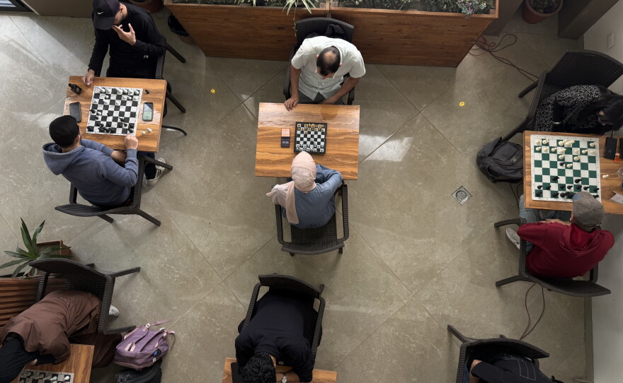 Young Palestinian chess players gather at a coffee shop in Gaza City for the first tournament since the start of the war, on May 12, 2026.