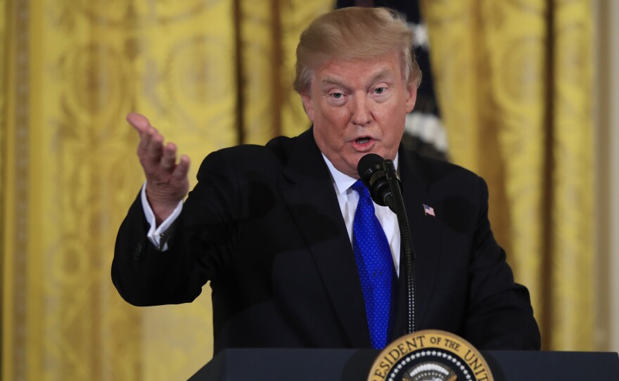 President Trump speaks to a gathering of mayors in the East Room of the White House on Wednesday.