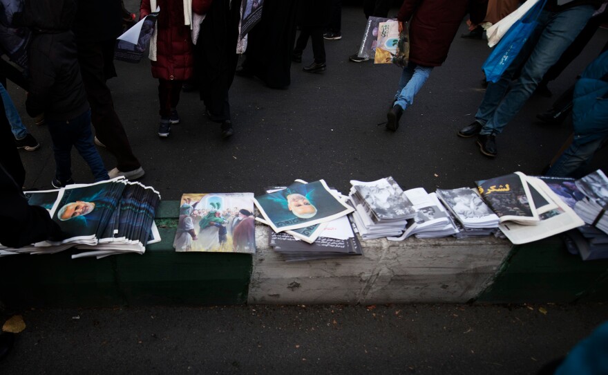 Poster-size portraits of Soleimani were distributed among people who attended the procession.