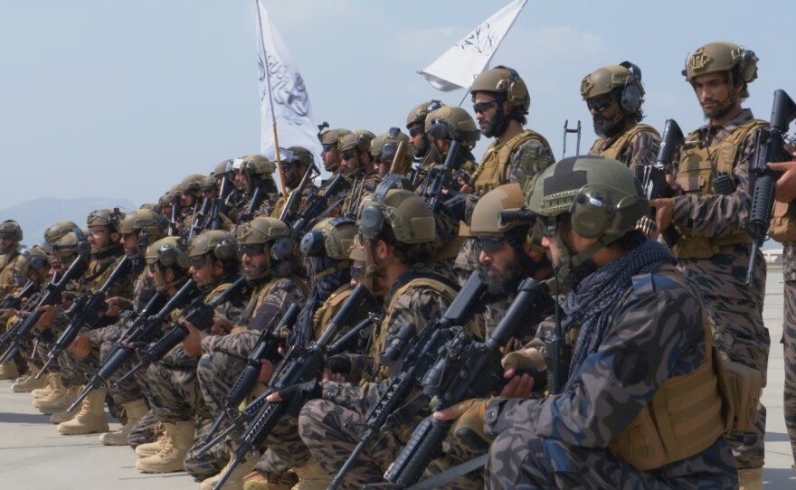 A Taliban military unit stands outside the Kabul airport following the departure of the last U.S. plane from Afghanistan on Aug. 31, 2021.