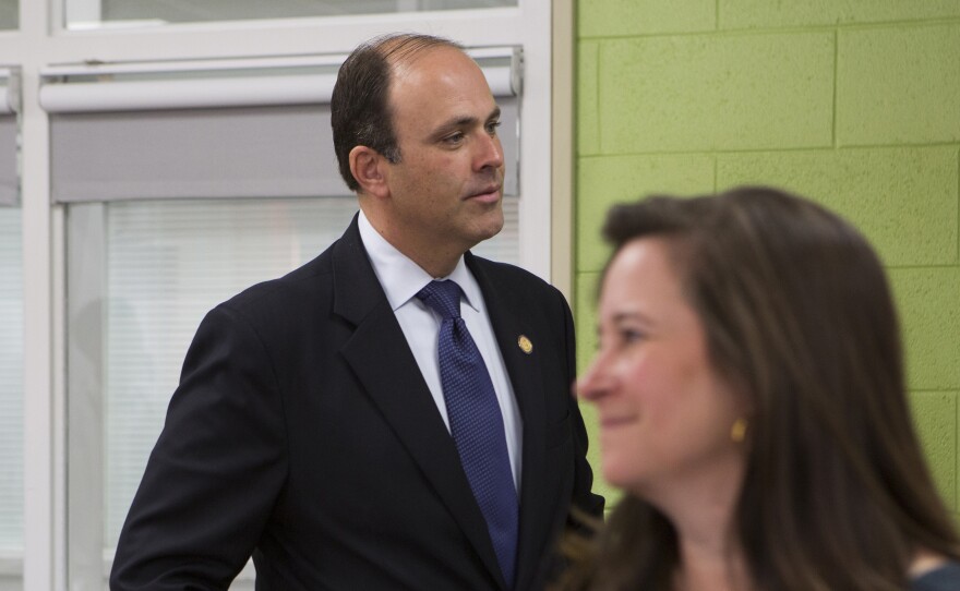Virginia House of Delegate candidates Republican David Yancey and Democrat Shelly Simonds attend an event at Heritage High School in Newport News, Va., on Nov. 28, 2017. Yancey won the tie-breaking drawing on Thursday.