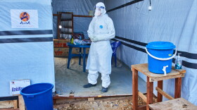 A health worker stands at the Evangelical Medical Center, in Bunia, eastern Congo, Friday, July 3, 2026, where Ebola clinical trials are scheduled to take place.