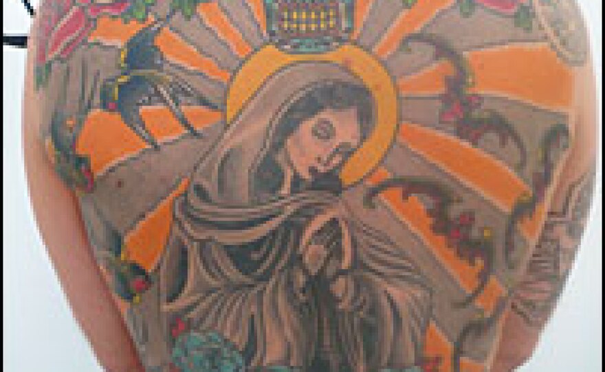 Belgian artist Wim Delvoye tattooed Tim Steiner's back with what Delvoye calls an atlas of what "tattoo" represents.