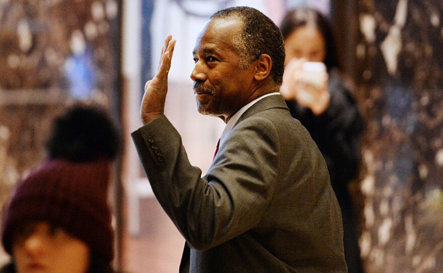 Retired neurosurgeon Ben Carson waves while arriving at Trump Tower last month. The Trump transition office announced early Monday Carson will be nominated to be HUD secretary.