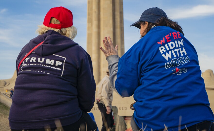 Supporters of President Trump and his Democratic challenger, former Vice President Joe Biden, talk in Kansas City, Mo.