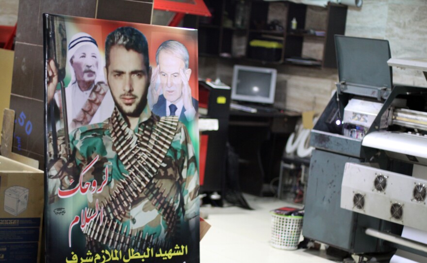 The print shop run by Lammah Jadeed used to make posters for cafes, but now mostly prints signs commemorating men who have died fighting for Assad.