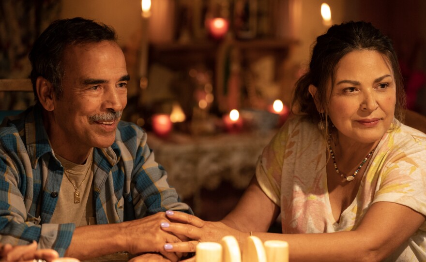 Damián Alcázar and Elpidia Carrillo play Jaimie Reyes' parents in "Blue Beetle," a Warner Bros. Pictures release.