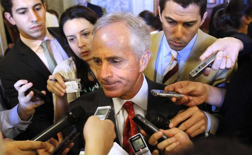 Sen. Bob Corker, R-Tenn. (center), talks to reporters on Capitol Hill. He decided Tuesday not to seek a third term. Corker is the first Senate retirement of the 2018 election cycle.