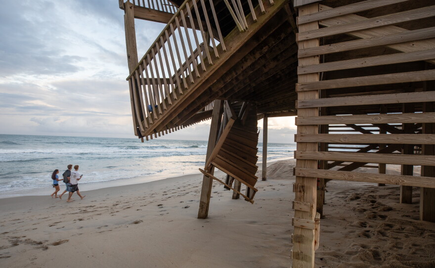 As sea level rise accelerates erosion around the U.S., there is growing alarm among waterfront homeowners, local officials and even members of Congress. Here, a damaged porch hangs precariously over the sand on the Cape Hatteras National Seashore.