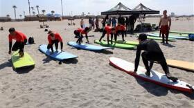 Wounded Warrior Marines prepare to surf