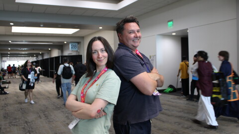 Mallory Rubin (left), the director of content at the Ringer and co-host of the podcast "House of R" poses with KPBS Roundtable host Andrew Bracken in the hallway of the San Diego Convention Center, Thursday, July 23, 2026.