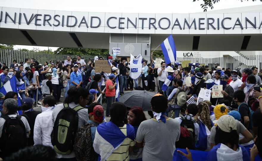 Demonstrators gather during a protest outside the Jesuit-run Central American University in Managua, Nicaragua.