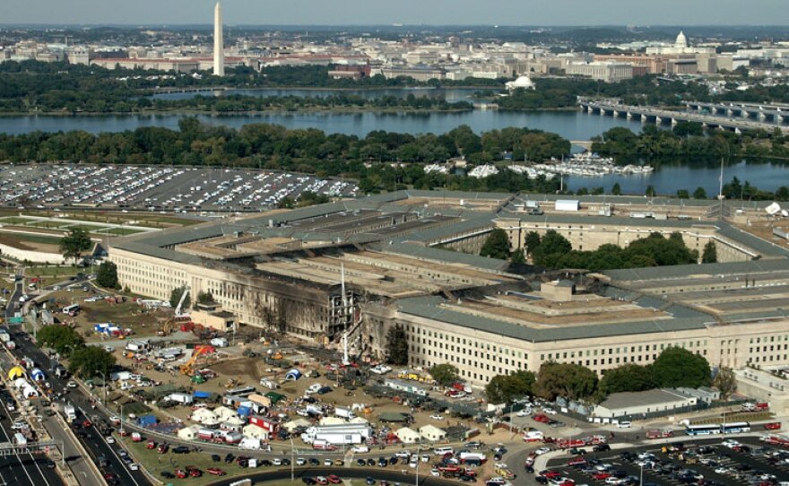 The Pentagon post 9/11 attack, Arlington County, Va., Sept. 11, 2001. Aerial with Washington Monument visible in the background.