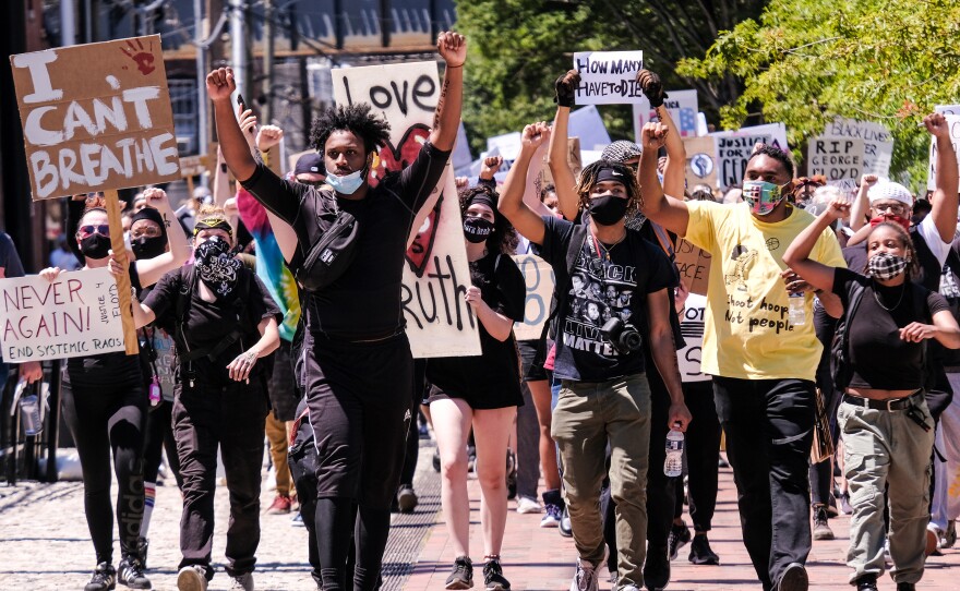 A crowd of peaceful protesters march through downtown Richmond, from Brown's Island to the 17th Street Market in Shockoe Bottom, June 7.