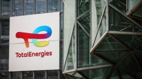 A sign for the French company TotalEnergies is displayed at headquarters March 21, 2025, in La Defense business district outside of Paris.