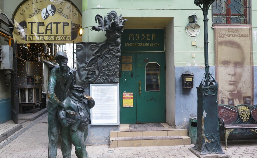 Statues of two devilish characters from The Master and Margarita greet visitors to the Bulgakov House Museum in Moscow. The exhibits combine memorabilia from the writer's life with whimsical displays and secret passages.