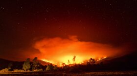 In this Sept. 16, 2020 file photo the August Complex Fire burns near Lake Pillsbury in the Mendocino National Forest, Calif. 