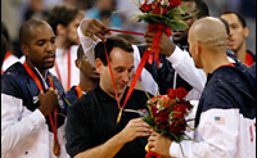 U.S. head coach Mike Krzyzewski of the United States receives a gold medal from Lebron James after defeating Spain in the gold medal game during Day 16 of the Beijing 2008 Olympic Games.