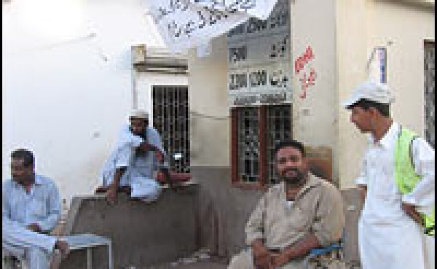 Mohammad Nader (seen here at right at an Edhi Foundation ambulance outpost at Jinnah Hospital) works for 24 hours at a time, waiting for accidents or news of violence in Karachi.