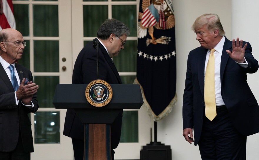 President Trump departs a July 2019 press conference on the census with U.S. Attorney General William Barr (center) and Commerce Secretary Wilbur Ross in the White House Rose Garden.
