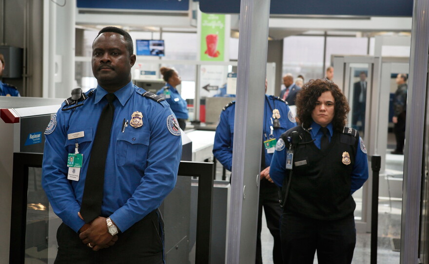 Transportation Security Administration officers staff a checkpoint at O'Hare International Airport in Chicago, Ill., in this 2010 file photo. The agency was created after the Sept. 11, 2001, attacks — but not every U.S. airport uses federal screeners.