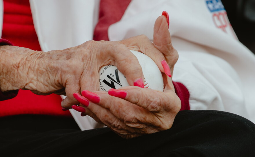 Maybelle Blair, a veteran of the All-American Girls Professional Baseball League, a professional women's baseball league that was founded in 1943 and ran for 12 seasons, grips a baseball prior to throwing out the first pitch at the WPBL's inaugural game in Springfield, Ill., on Saturday, Aug. 1.