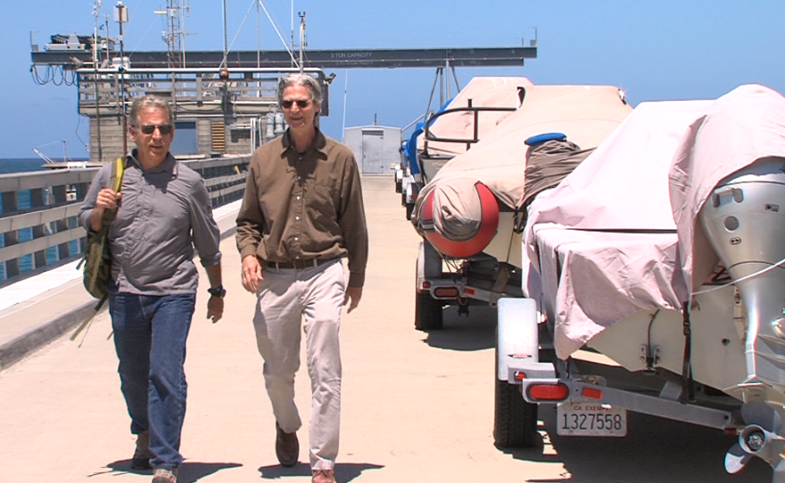 Scripps Center for Marine Archeology co-directors John Hildebrand and Tom Levy walk along the Scripps pier, June 12, 2017.