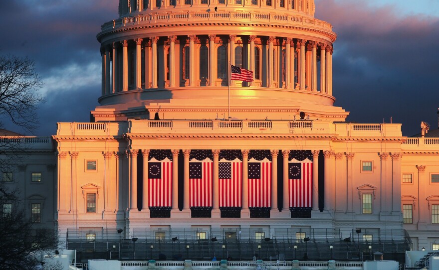 The sun sets on the West Front of the U.S. Capitol building ahead of inauguration ceremonies for President-elect Donald Trump on Wednesday.