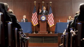 President Obama, flanked by Senate Majority Leader Harry Reid (left) and House Speaker Nancy Pelosi, speaks to the House Democratic Caucus about the need to pass health care legislation.